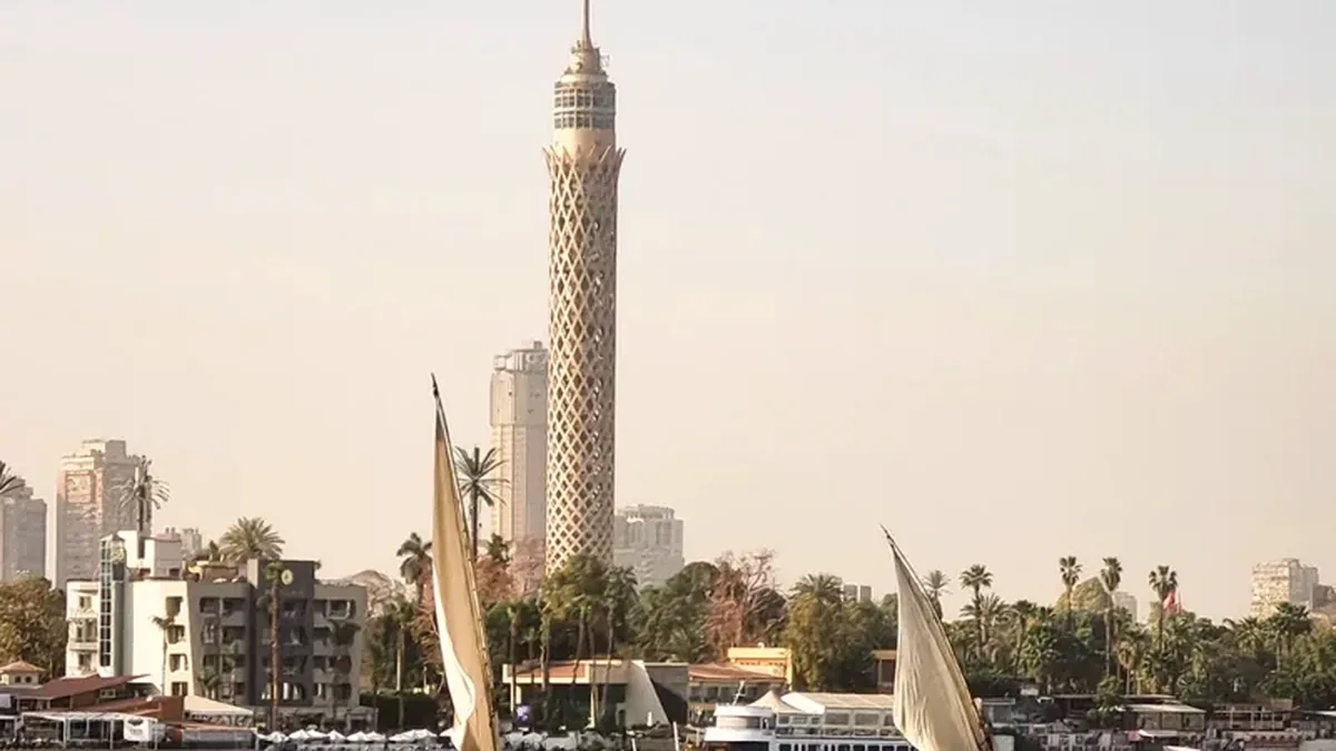 Feluccas sailing the Nile with the Cairo skyline behind